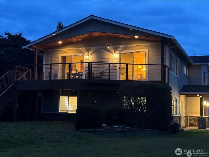 The view deck on the West side of the home face the Sound and Olympic Mountains for beautiful views all day and spectacular sunsets!  The deck was engineered for a hot tub and has hot and cold water faucet, power, and gas for a grill.
