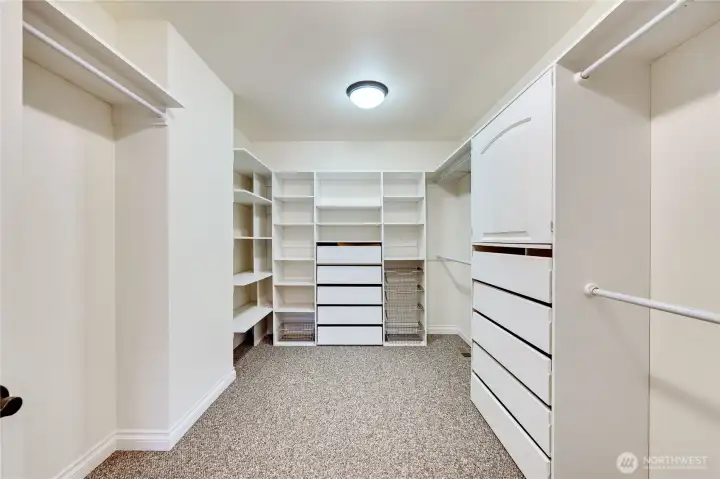 The closet in the primary bedroom is huge! Built-in drawers, shelving and lots of hanging space.