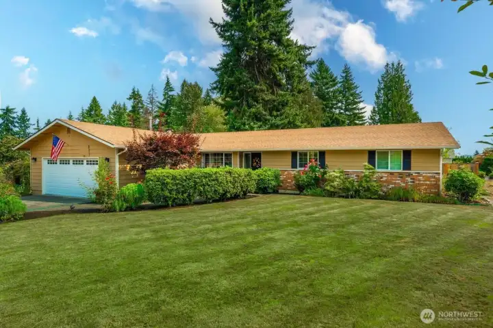 Beautiful landscaping adds to the warmth and beauty of this 3 bedroom home.