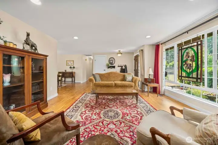 Natural light pours through the large picture window in the formal living room.