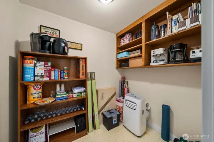 This walk in pantry is just off the laundry room and is the perfect space for all those extra appliances and anything else you need space for.