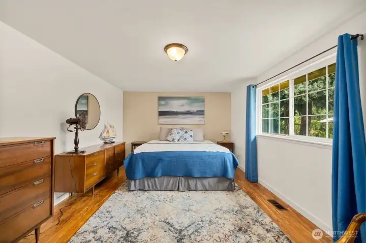 Light and bright Primary bedroom with walk thru closet and upgraded 3/4 bath with walk in shower.