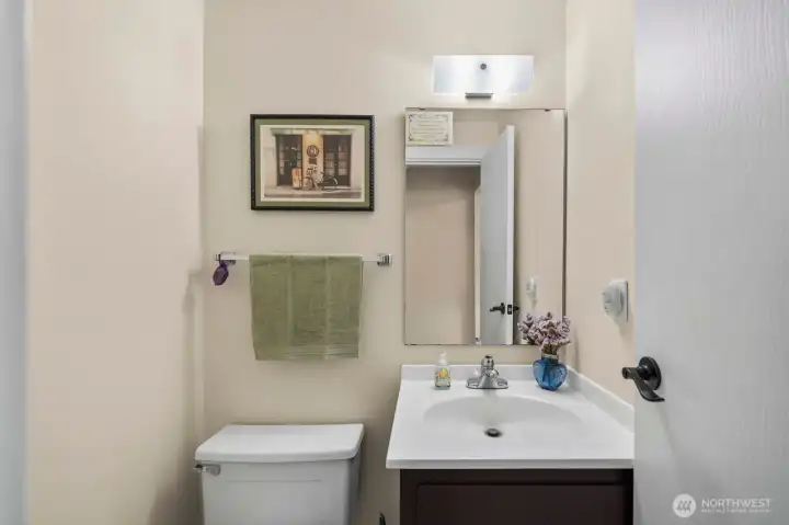 Half bath off the laundry room, also   close to family room.