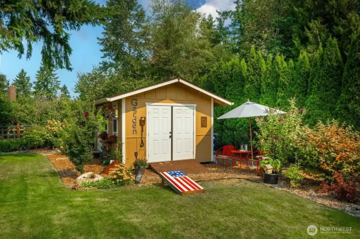 This darling little shed has a massive amount of storage inside.  Built on site with double doors for your lawn mower and a man door as well.