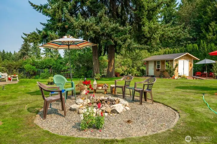 Delightful back yard beacons you to sit a little awhile longer!