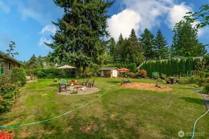 Hoses are hooked up to a drip system on a timer that keeps the landscaping lush all summer long.