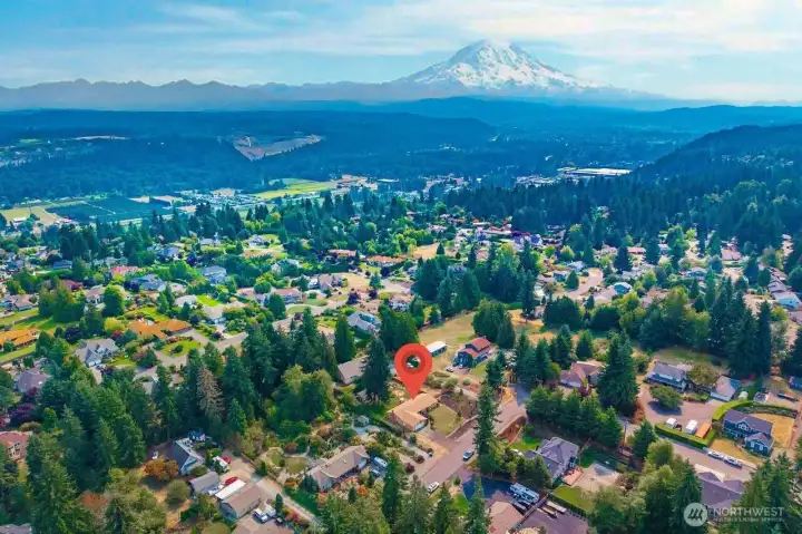 Aerial shot shows how big the yard is and the Mountain in the back ground which you have a peek a boo view of from the front yard.