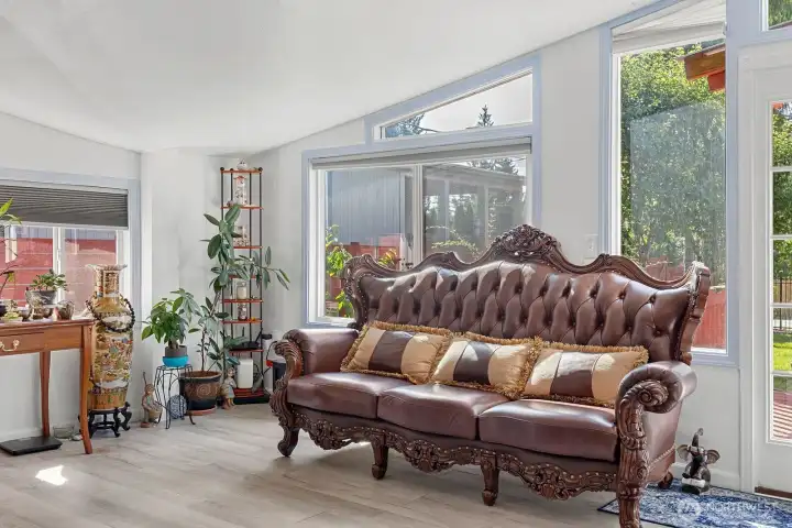 Entry with large windows allowing light to fill the space