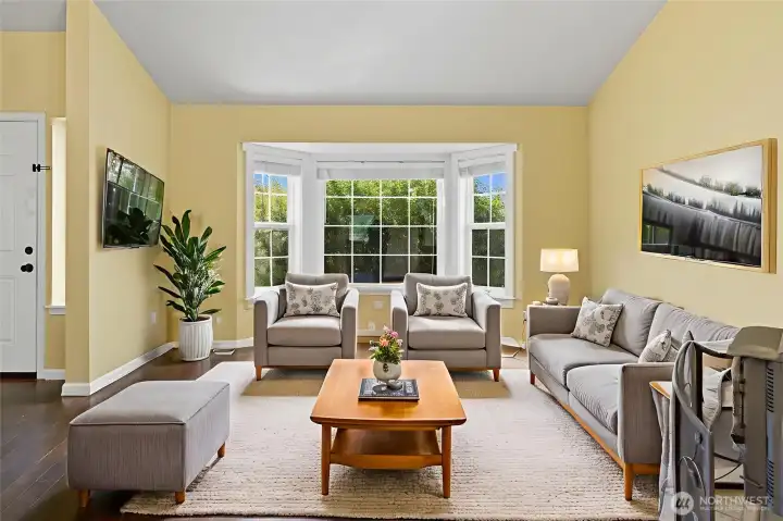 The formal living room is the place to host guests and also lets you step away from the bustle of the kitchen and Great Room area. This home is virtually staged.