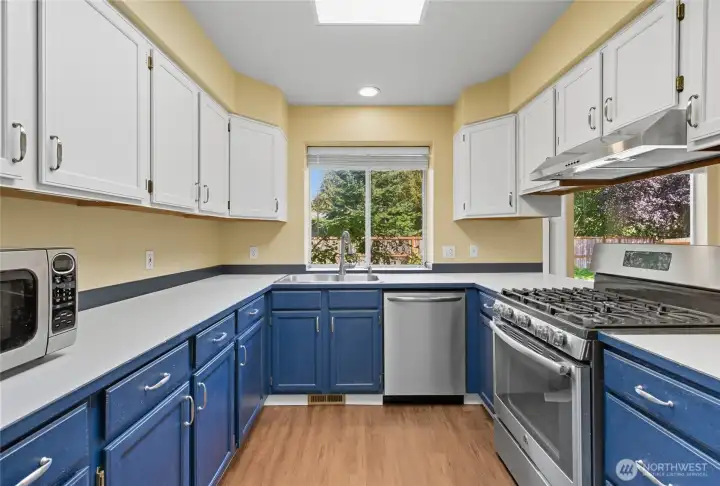 Plenty of counter space and cabinets for your culinary creations in this functional kitchen.