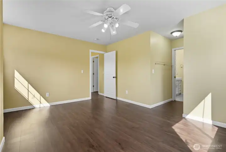 The large primary bedroom features an attached bathroom and walk in closet.