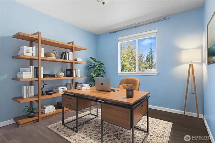 Upstairs bedroom is ready for guests or is an ideal WFH location. This home is virtually staged.