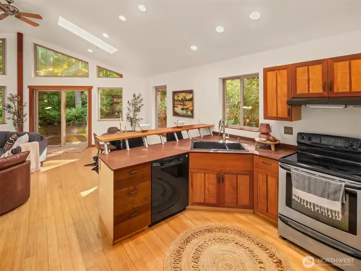 This is a lovely space to live in with vaulted ceilings, bamboo floors, eating bar and open floor plan.