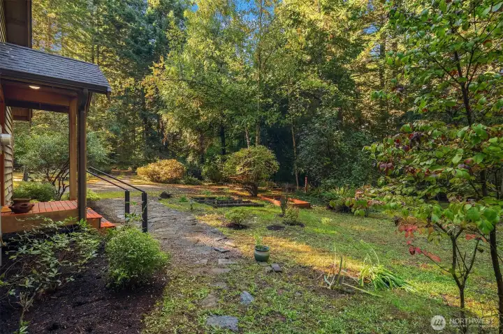 Looking from the east out to the entry and driveway. Raised beds, too!