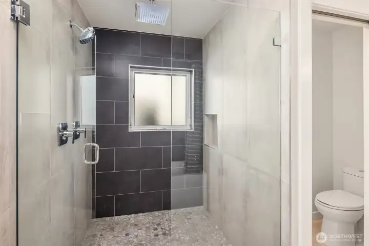 Primary bath with spacious rainfall shower