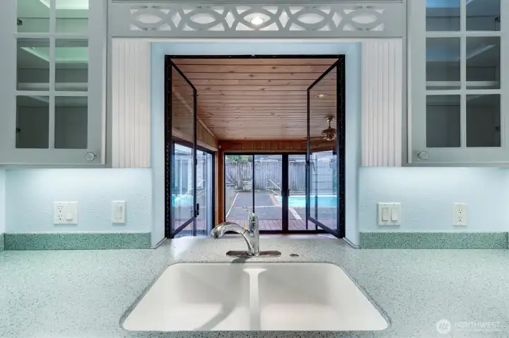 Double windows open out to the sun room