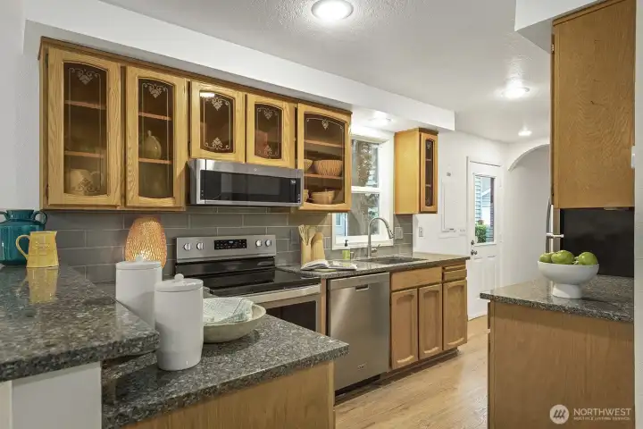 Charming and Victorian inspired kitchen that tastefully compliments the exterior of home.