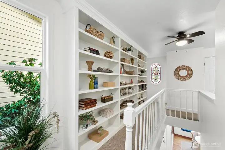 Custom built bookshelves as you enter the second floor.