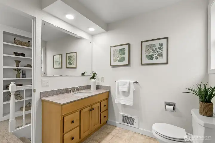 Full bathroom on second level with updated vanity, and tiled shower.