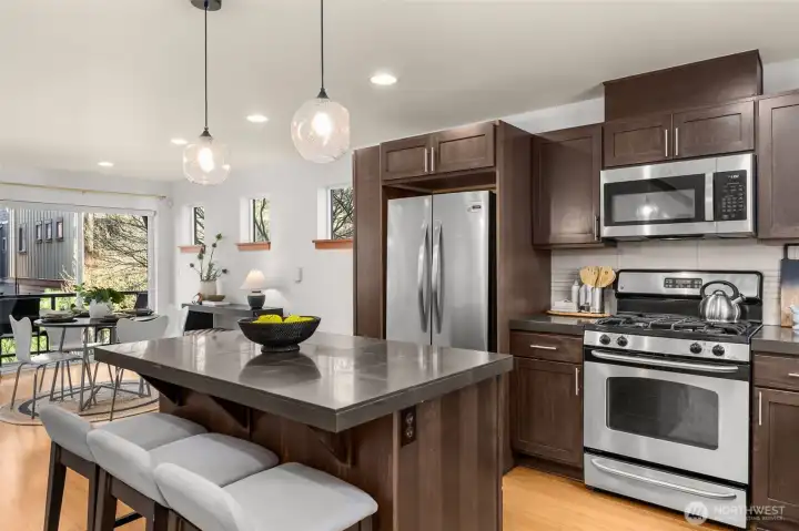 New stainless steel appliances, ample storage in the cherry wood cabinetry and a half bath on the same floor.