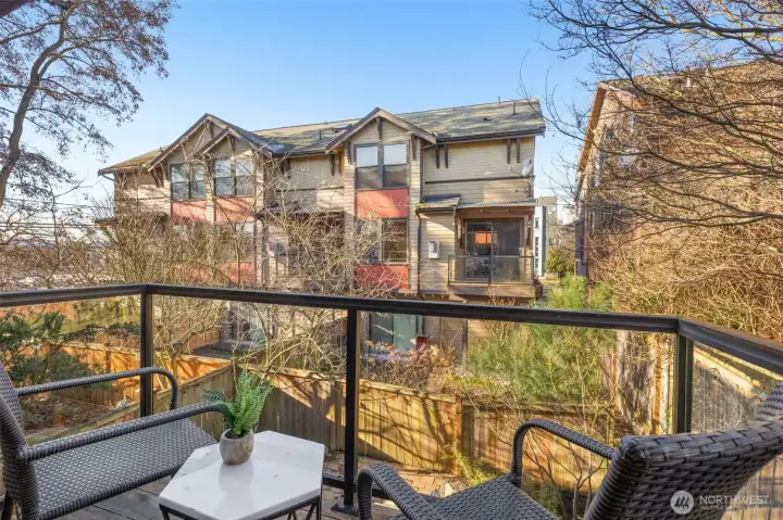 Private balcony with glass paneled railings.