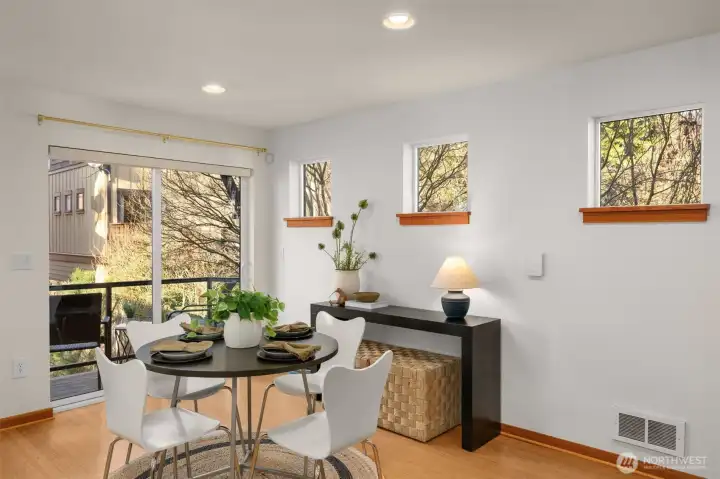 Spacious dining room features a slider out to your private balcony.