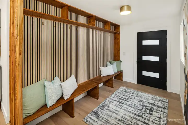 Hat rack, jacket hooks, and bench all serve to make leaving and coming home a breeze.