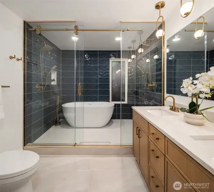 Primary en suite spares no expenses with heated floors, deluxe shower room, dual shower heads, and more.