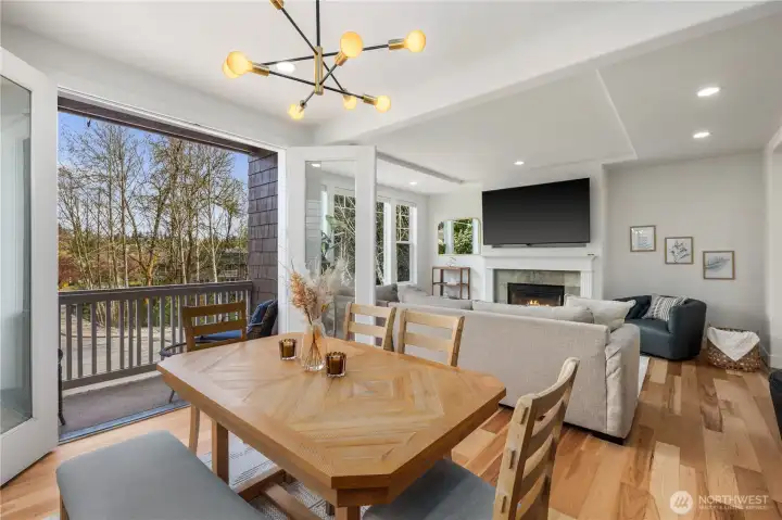 Covered balcony off the dining area with peaceful greenbelt views