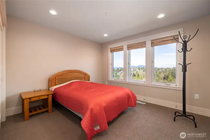 This is the 3rd bedroom in the home, also upstairs. This one has a bit of that gorgeous view.