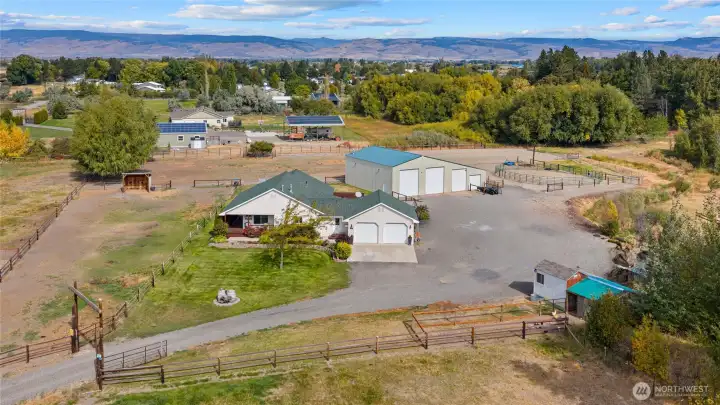 Tucked in a private location on 3.5 acres with irrigation - there are multiple fenced pastures