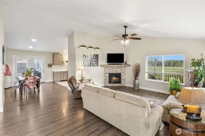 Lovely great room with natural gas fireplace with stone facade and mantle.