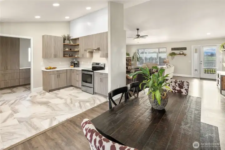 Open to dining room.  Open shelving add useful storage and warm design features!
