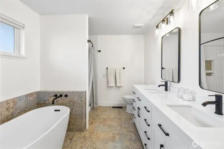 New full bath off primary - new tile, new shower tile, new vanity, new   mirrors and all new fixtures!