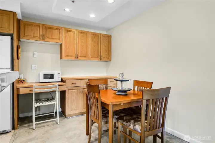 Entering dining area from livingroom.  Cute work desk is built into the cabinetry
