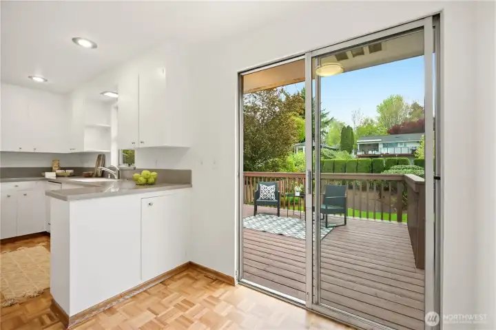The "eat in" area with slider that leads to the freshly stained back deck.