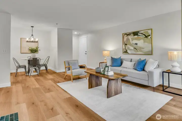 Spacious living and dining areas with wide plank LVP flooring—perfect for everyday living and entertaining.