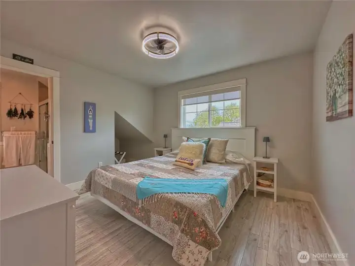 Upper-level bedrooms offer flexible and inviting space for guests, vacation living, or additional family accommodations. Upper-level bedrooms offer flexible and inviting space for guests, vacation living, or additional family accommodations.