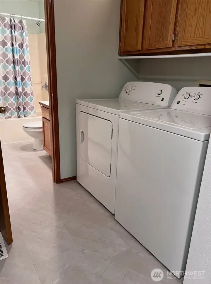 Laundry area with nice storage cabinets