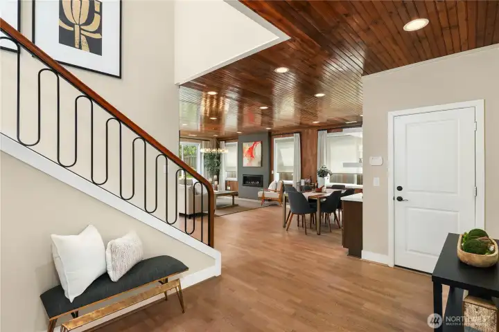 Inviting entry with walnut and metal decorative balusters. Inviting entry with walnut and metal decorative balusters.