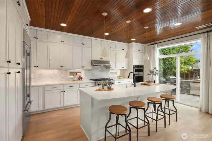 A chef inspired kitchen with full height custom cabinets provides plenty of storage. A chef inspired kitchen with full height custom cabinets provides plenty of storage.