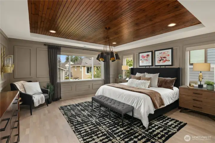 Primary bedroom with custom wall treatments and upgraded lighting. Primary bedroom with custom wall treatments and upgraded lighting.