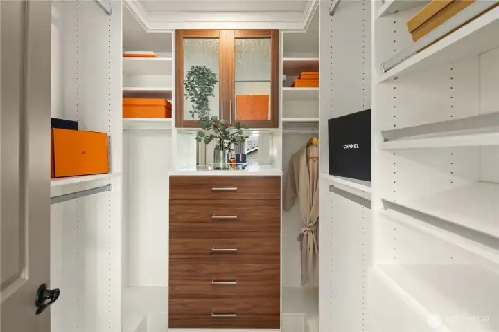 Dual closets with custom built in cabinets and shelving. Dual closets with custom built in cabinets and shelving.