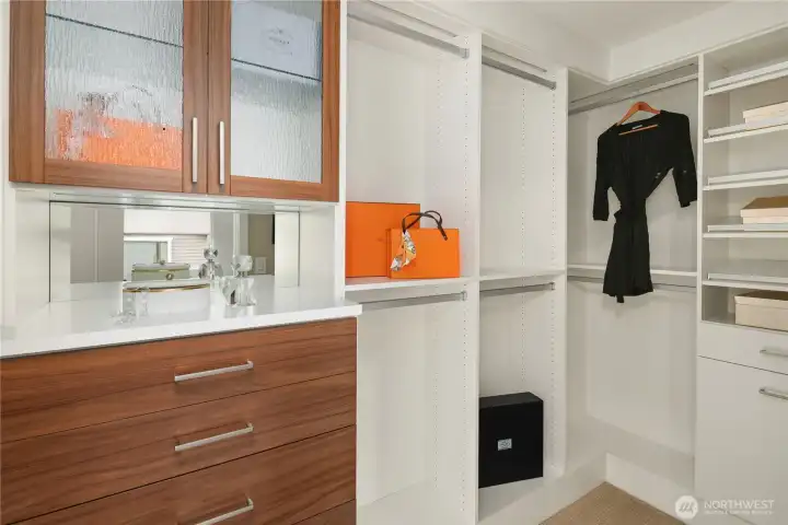 Dual closets with custom built in cabinets and shelving. Dual closets with custom built in cabinets and shelving.