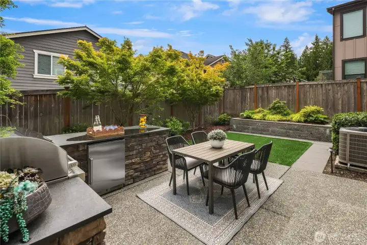 Outdoor kitchen with Wolf built in grill and artificial turf. Outdoor kitchen with Wolf built in grill and artificial turf.