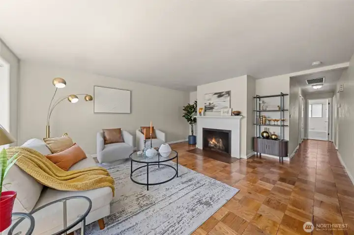 Original parquet hardwood floors and a cozy wood-burning fireplace create a warm welcome. Original parquet hardwood floors and a cozy wood-burning fireplace create a warm welcome.