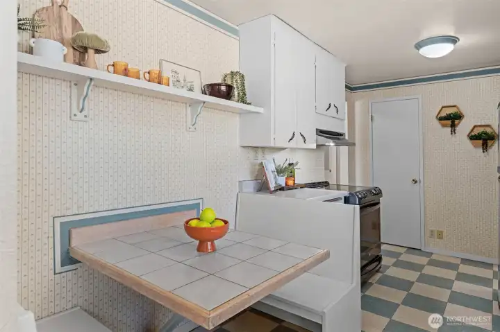 A cheerful breakfast nook is the perfect spot for morning coffee or casual meals. A cheerful breakfast nook is the perfect spot for morning coffee or casual meals.