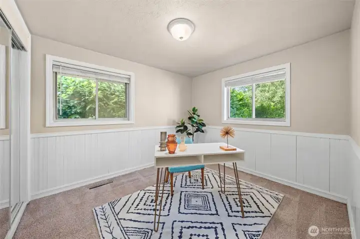 Currently staged as an office, this versatile bedroom enjoys windows overlooking both the backyard and lush landscape. Currently staged as an office, this versatile bedroom enjoys windows overlooking both the backyard and lush landscape.