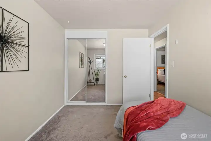 Mirrored closet doors reflect light and create an open feel. Mirrored closet doors reflect light and create an open feel.