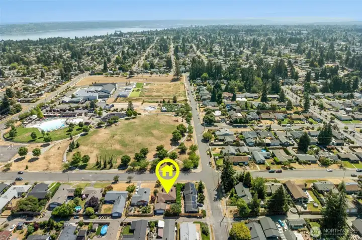 Looking east over Kandle Park toward the Proctor District, Ruston waterfront, and, on clear days, glimpses of Mount Rainier beyond. Looking east over Kandle Park toward the Proctor District, Ruston waterfront, and, on clear days, glimpses of Mount Rainier beyond.